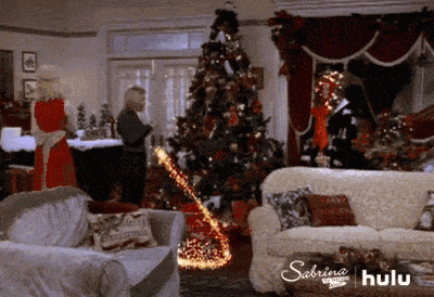 Sabrina lights the tree